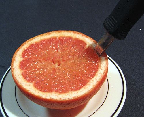 Hoe maak je een grapefruit te eten. Wacht tot je in de stemming om te grapefruit eten.